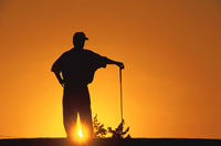 golfer during sunset